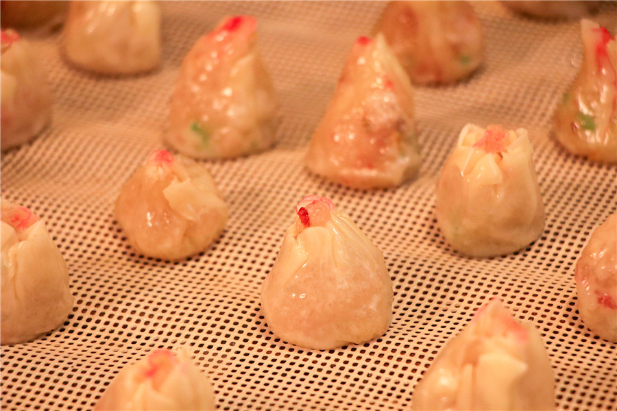 非遺美食“廬江小紅頭”。